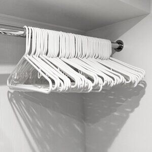 set of 60 white plastic hangers